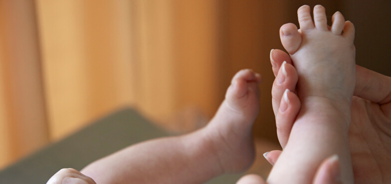 babys feet held